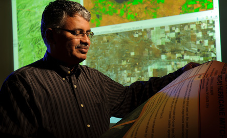 Remote sensing professor looking at papers