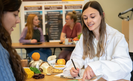 Two students work together in a nutrition class