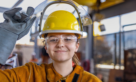 Sculpture student wearing a hard hat