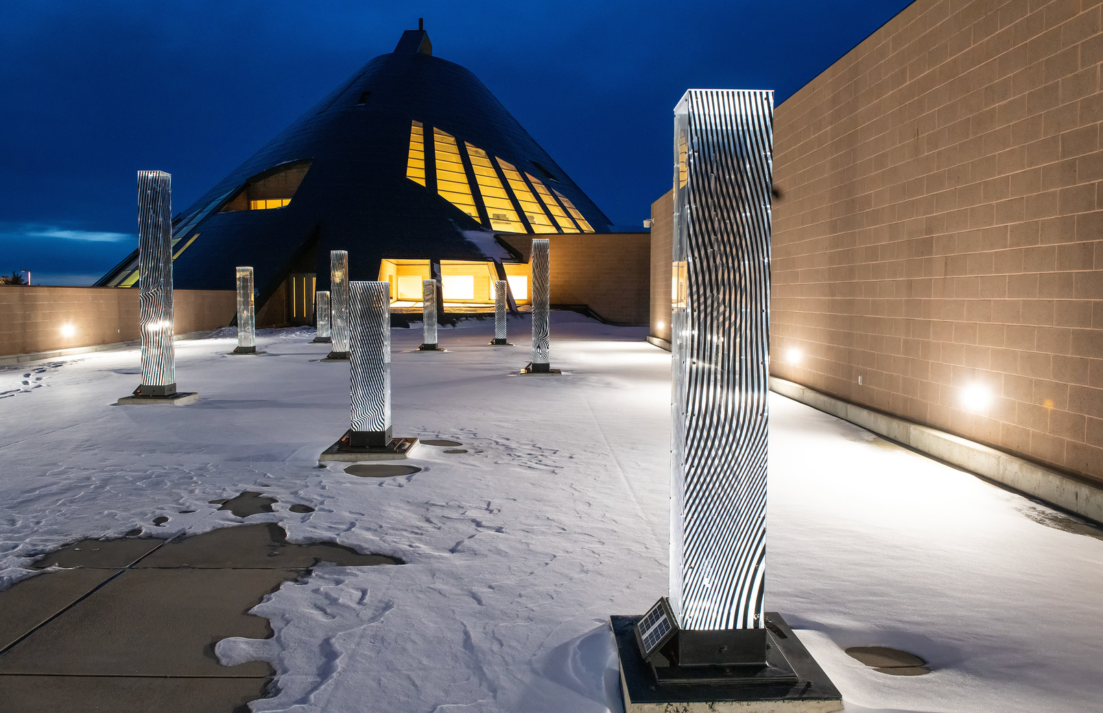 Sculptures on the roof of the American Heritage Center on campus