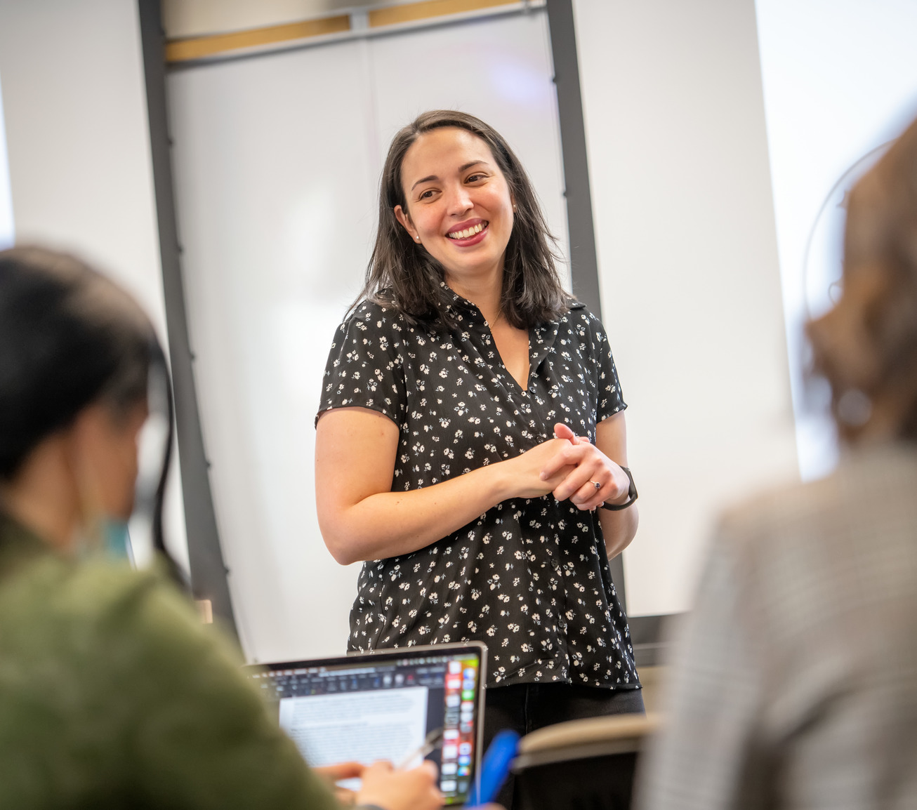 Teacher teaching in front of classroom