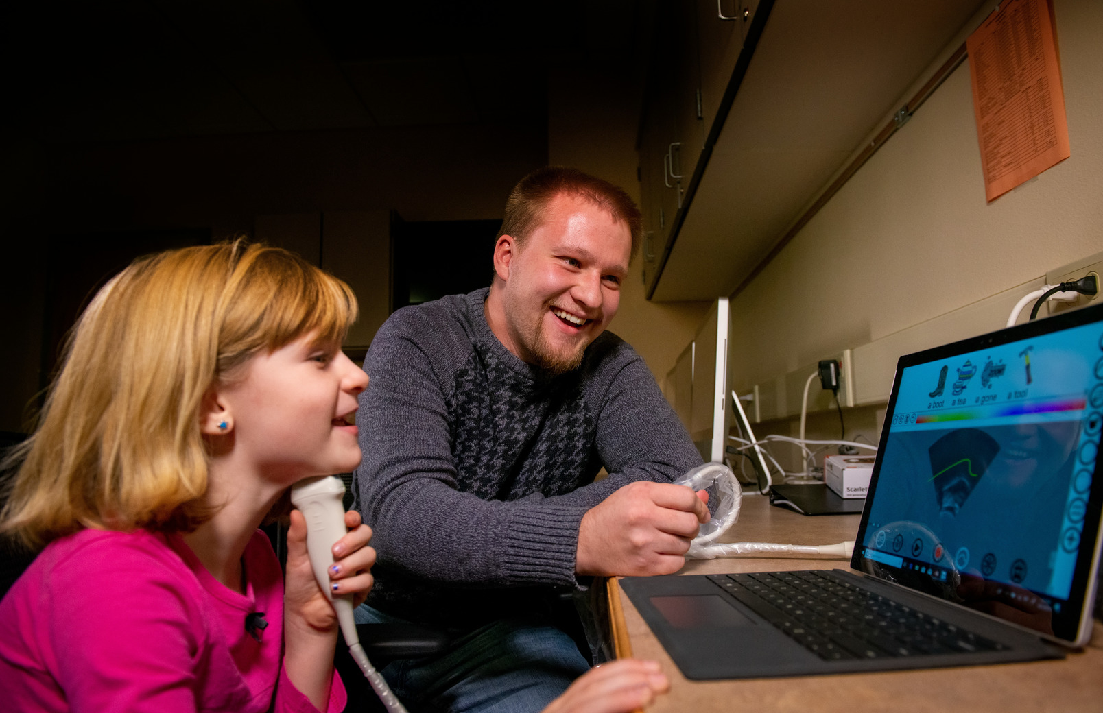 Speech pathologist working with child