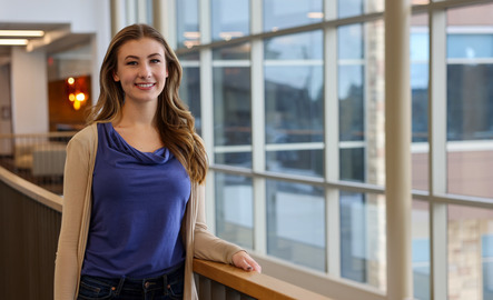 A sociology student smiles for a photo
