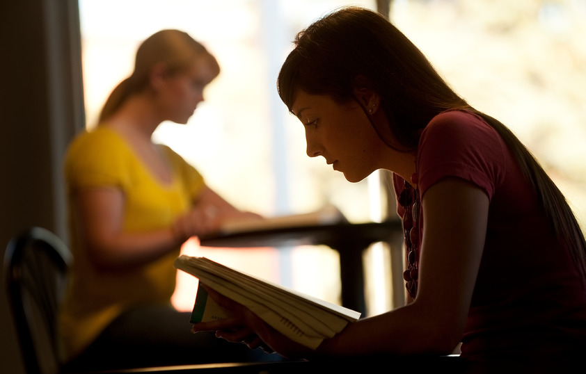 Student reading a book