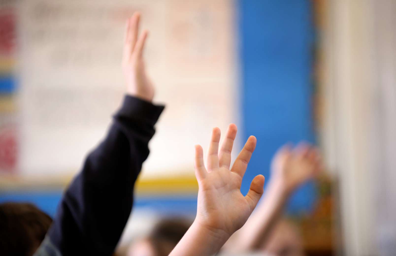 Kids raising hands