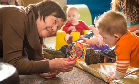 A counselor plays with a child