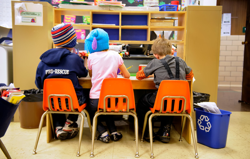 Students working at a desk together