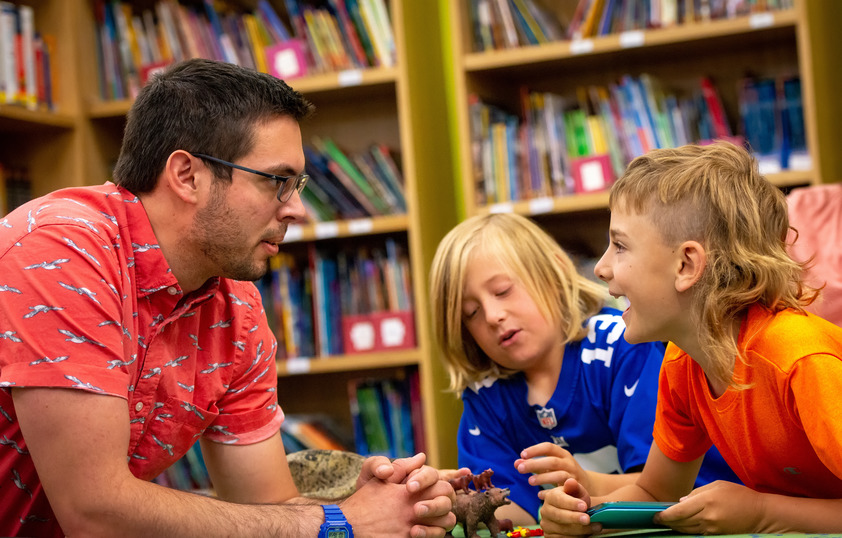 Teacher working with students