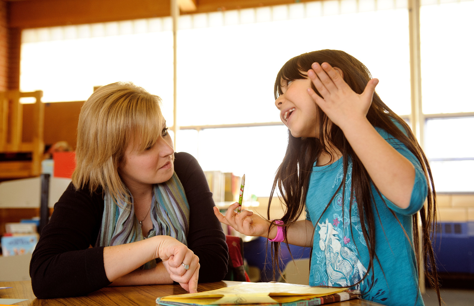 Teacher working with student