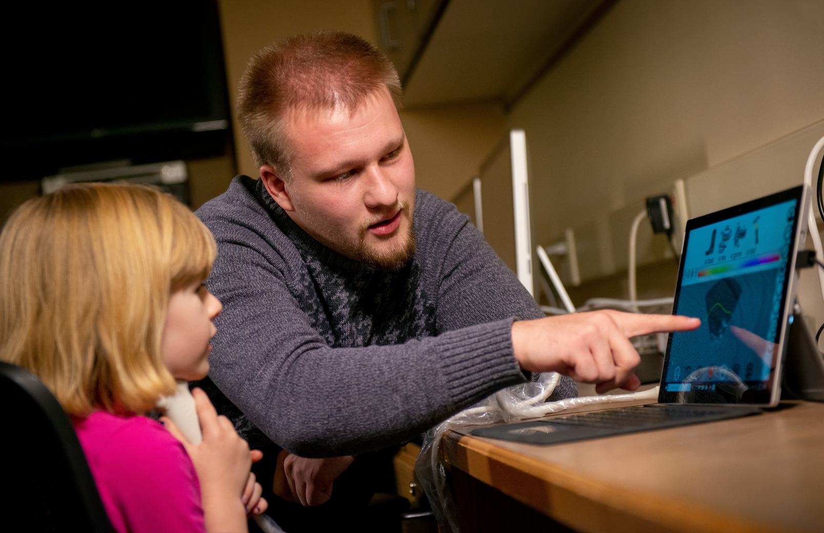 Speech pathologist working with child