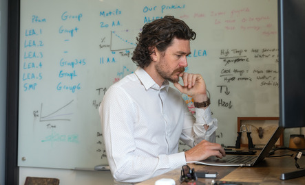 Statistics faculty member working on computer