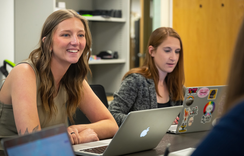 Two students working on their laptops