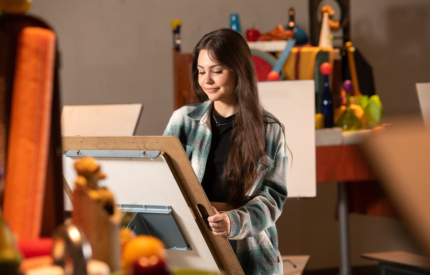 an artist working on a drawing