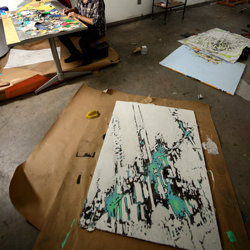 Paintings in a studio