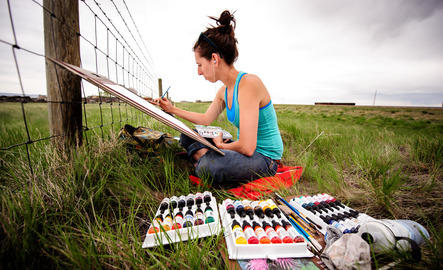 Student paints outside