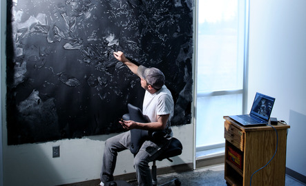Art professor works on a painting