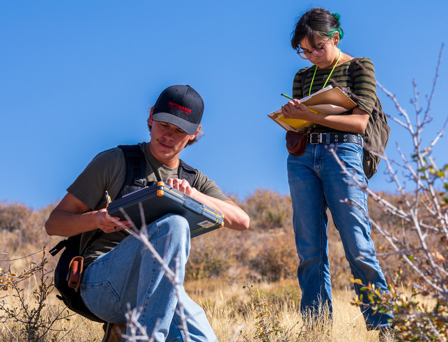 Two students out in the field