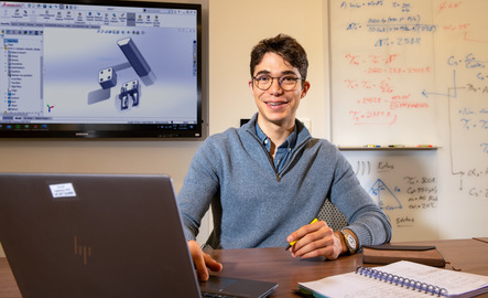 A student smiles for a photo