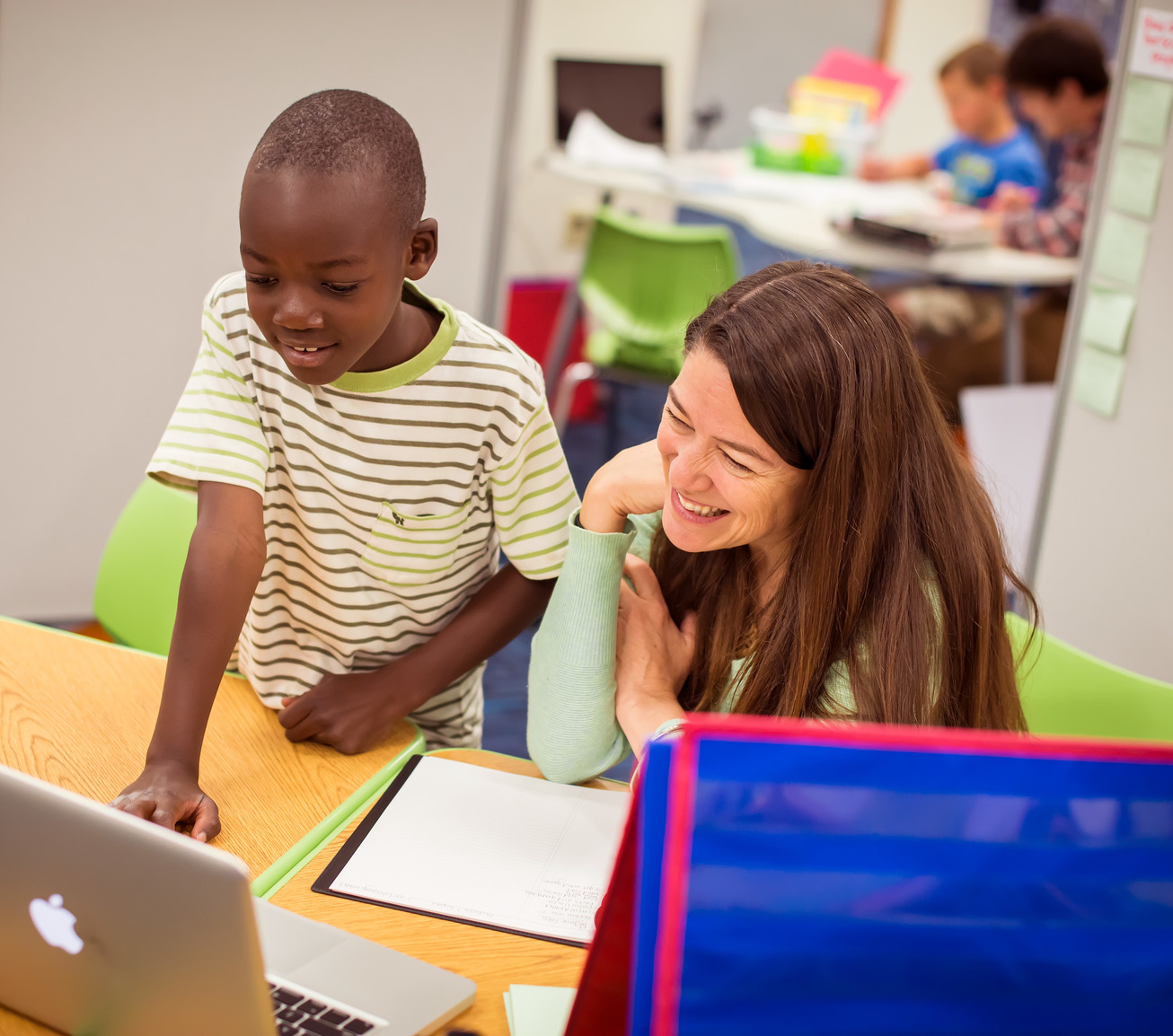 Teacher working with student