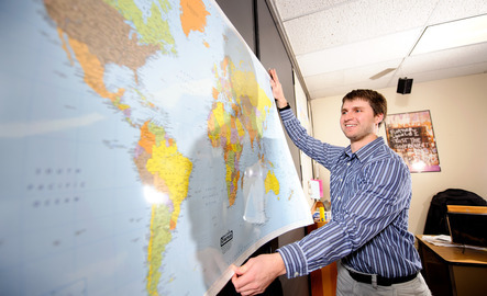 Teacher holds up a map