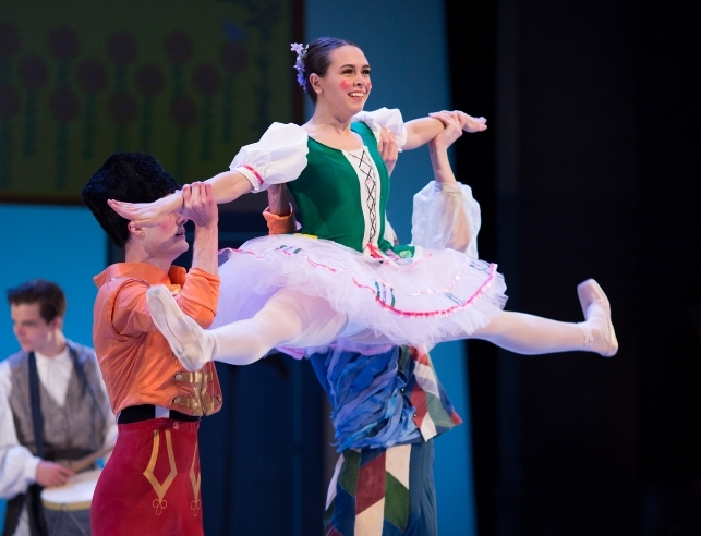 Dance students lift ballerina into the air