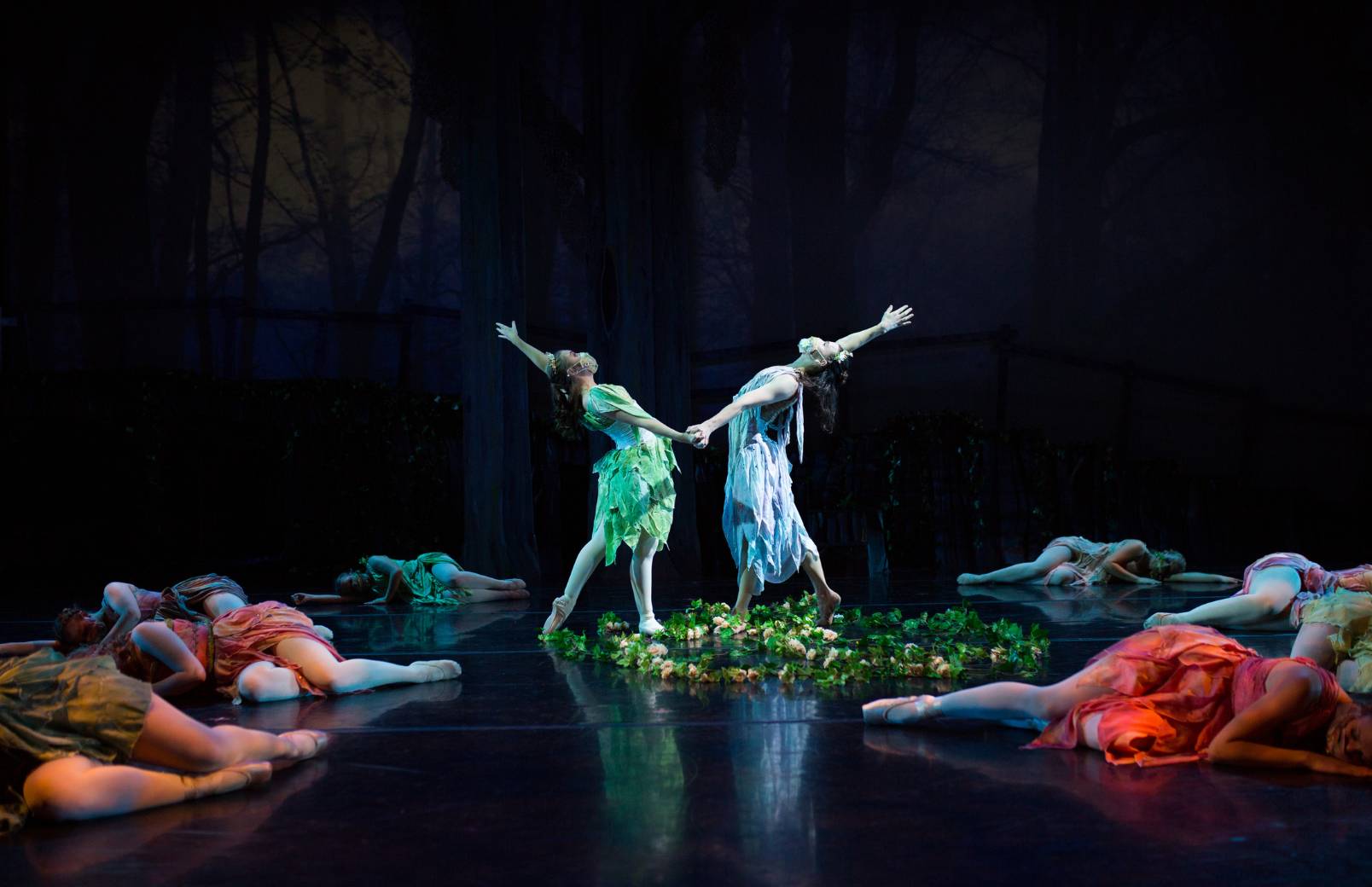 Group of dancers dressed in fairy costumes performing on stage