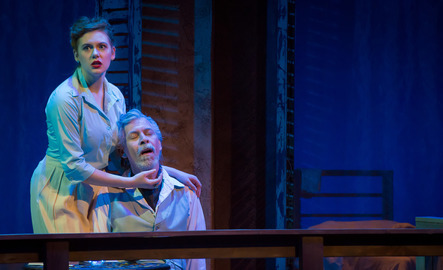 Two student perform a scene on stage