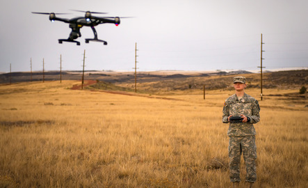 An army cadet flys a drone