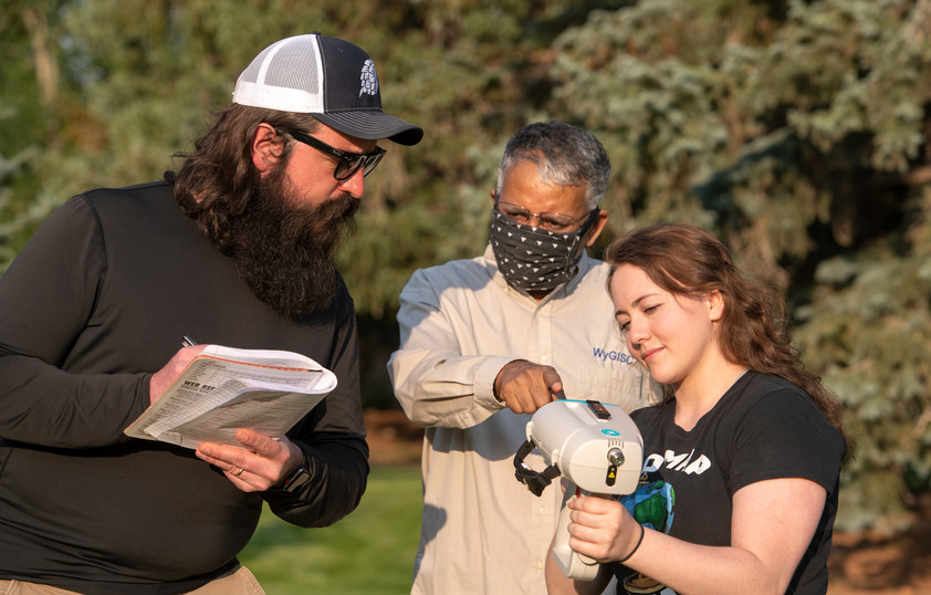 Two students and faculty member work toghether on GIST project.