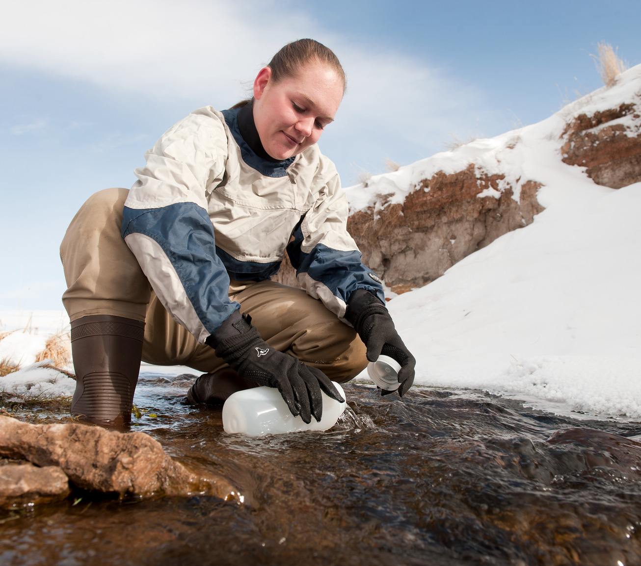 Student collecting river water