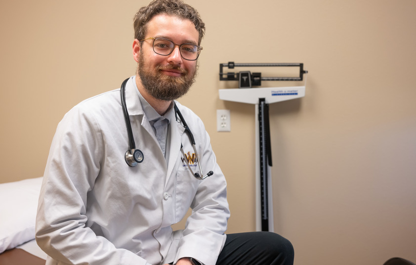 A medical professional smiles for a photo