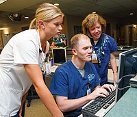 Medical students working at computer