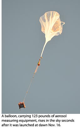 A balloon, carrying 123 pounds of aerosol measuring equipment, rises in the sky seconds after it was launched at dawn Nov. 16.