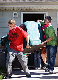 Two students working on house
