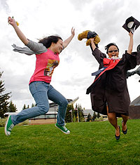 Two students jumping
