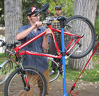 man working on bicycle