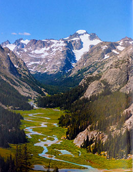view of valley, creek and mountains