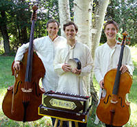 three men with musical instruments standing outside