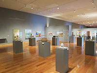 art museum view of display pedestals with artwork on them