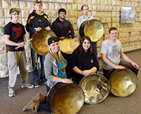Group of people with pan band metal instruments