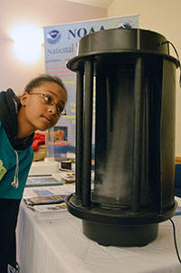 girl looking at scientific device