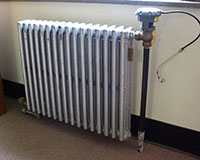 a radiator beside a wall