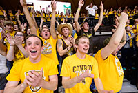young men wearing UW tee-shirts in a crowd
