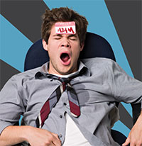 disheveled man in chair yawning with sticker on forehead