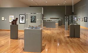 art gallery with exhibits placed around the floor and walls