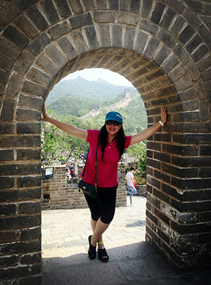 woman standing in brick archway