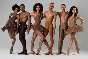 a group of dancers standing in a row