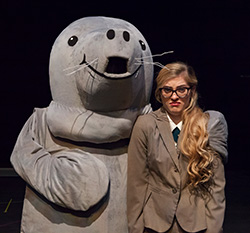 woman and a person in a manatee costume