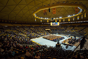 large arena full of people at a graduation ceremony