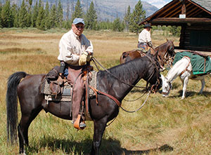 man on horseback looking at camera